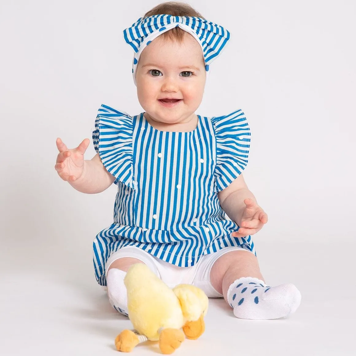 Completo blusa a righe e pantalone corto bambina