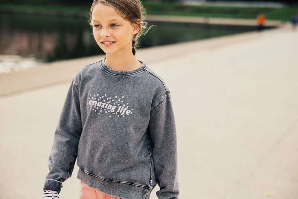 Maglia slavata a maniche lunghe per bambina