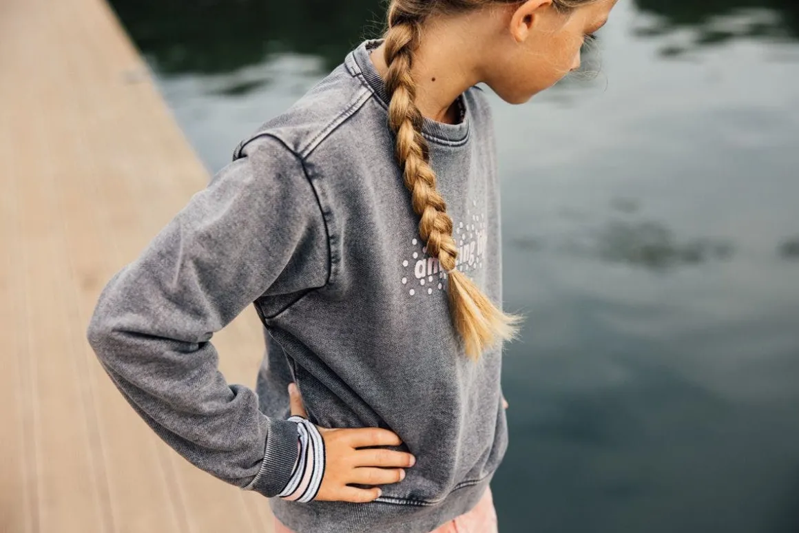 Maglia slavata a maniche lunghe per bambina