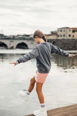 Maglia slavata a maniche lunghe per bambina