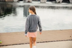 Maglia slavata a maniche lunghe per bambina