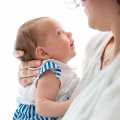 Pagliaccetto in jersey e tela da neonata
