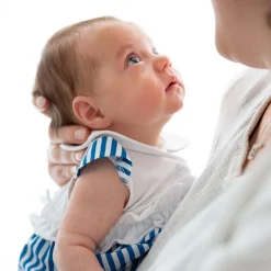 Pagliaccetto in jersey e tela da neonata
