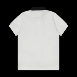 Polo da bambino elegante in piquet bianco.