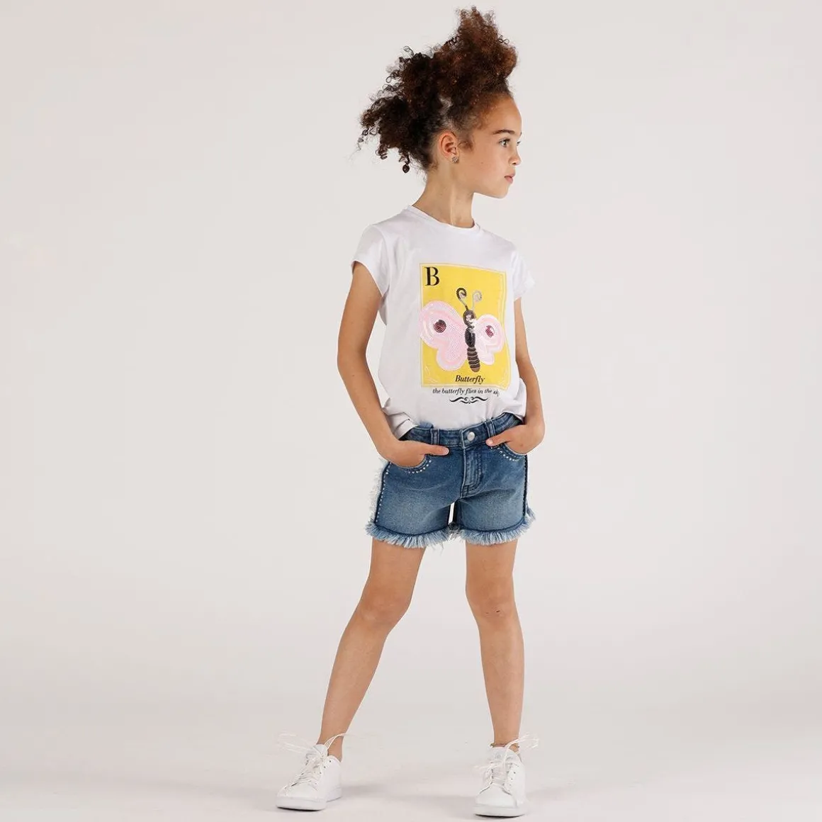T-shirt con stampa e paillettes da bambina